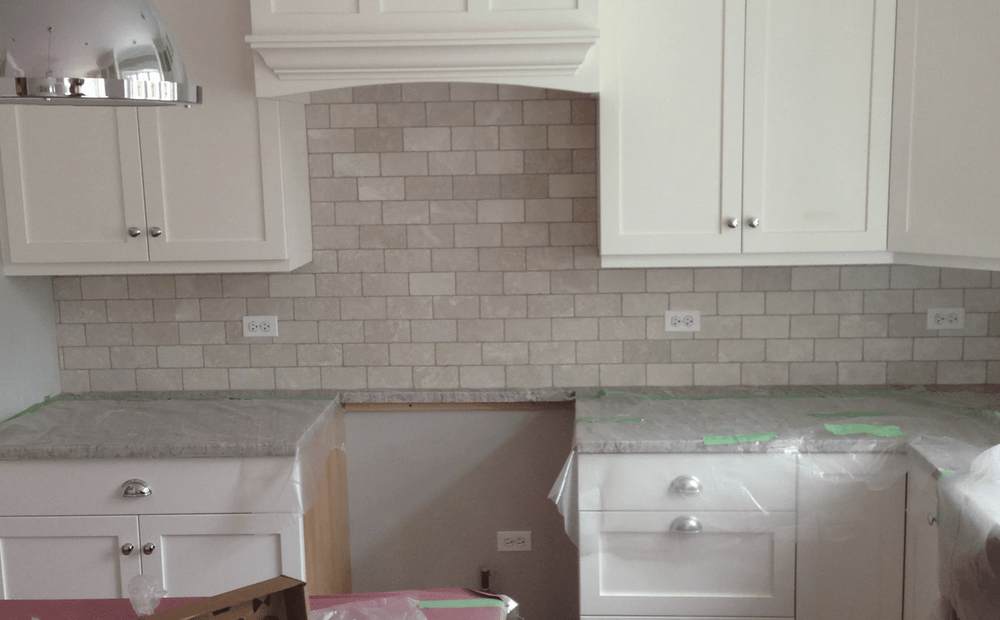 Tiled backsplash in the kitchen in  from Superb Carpets, Inc.